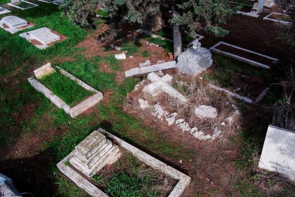 FILE PHOTO: An aerial view shows vandalized tombstones at the Protestant Mount Zion Cemetery where acts of vandalism took place in Jerusalem January 4, 2023. - REUTERSPIX