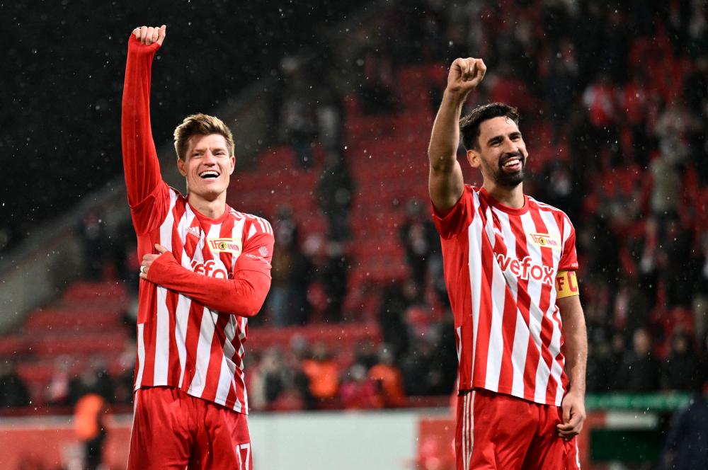 Filepix: FC Union Berlin’s Kevin Behrens (left) and Rani Khedira (right) celebrate after the match/REUTERSPix