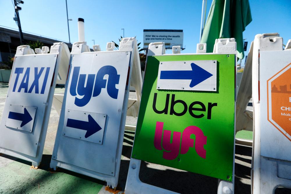 Uber ride-share signage is posted at Los Angeles International Airport (LAX) in Los Angeles, California, U.S. July 10, 2022. REUTERSPIX