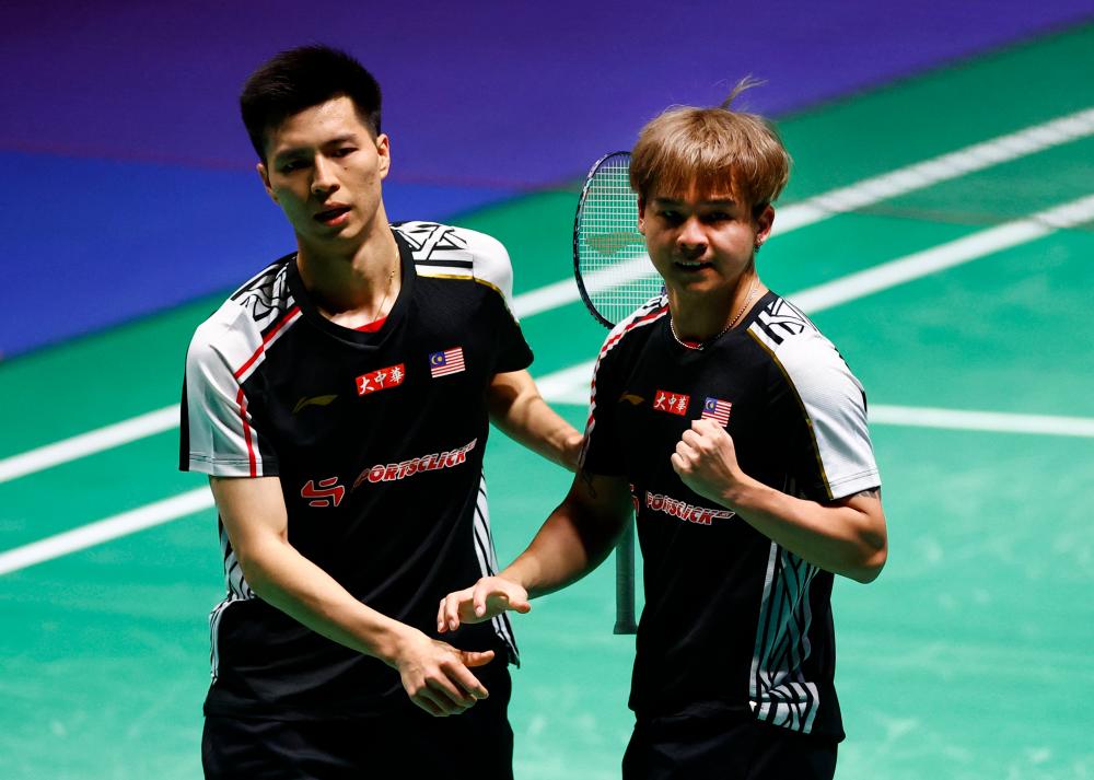 Badminton - All England Open Badminton Championships - Utilita Arena, Birmingham, Britain - March 14, 2023 Malaysia’s Ong Yew Sin and Teo Ee Yi react during their round of 32 men’s doubles match against Taiwan’s Lee Yang and Wang Chi lin. REUTERSPIX
