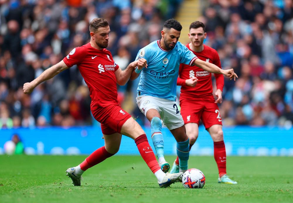 Football - Premier League - Manchester City v Liverpool - Etihad Stadium, Manchester, Britain - April 1, 2023 Manchester City’s Riyad Mahrez in action with Liverpool’s Jordan Henderson REUTERSPIX