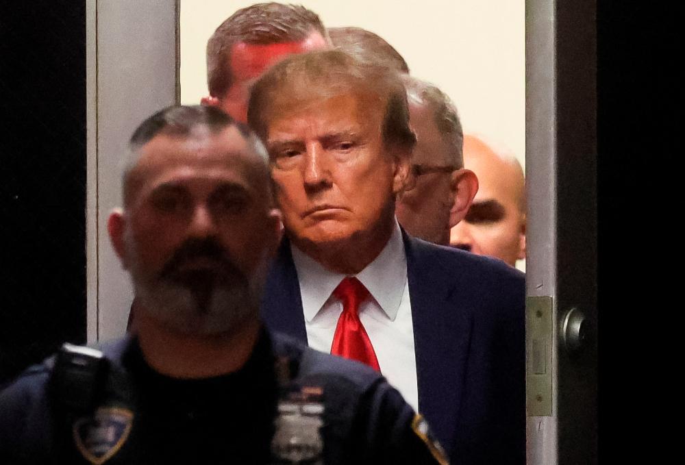 Former US President Donald Trump arrives at Manhattan Criminal Courthouse, after his indictment by a Manhattan grand jury following a probe into hush money paid to porn star Stormy Daniels, in New York City, US, April 4, 2023. REUTERSpix