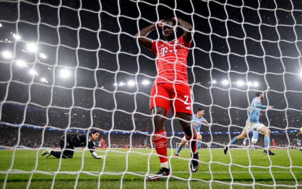 Bayern Munich’s Dayot Upamecano looks dejected after Manchester City’s Bernardo Silva scores their second goal/REUTERSPix