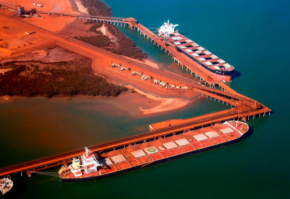 Ships waiting to be loaded with iron ore are seen at the Fortescue loading dock located at Port Hedland, in the Pilbara region of Western Australia December 3, 2013. REUTERSPIX