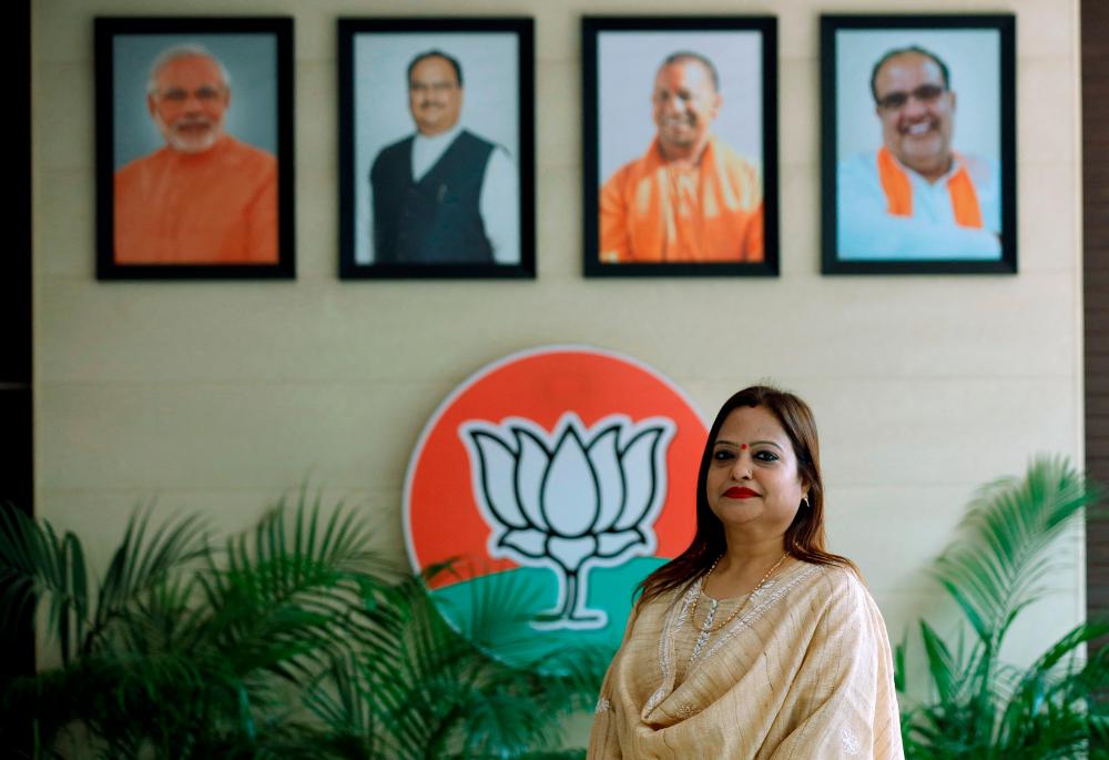 Ranika Jaiswal, 48, a treasurer in Uttar Pradesh women's wing of India's ruling Bharatiya Janata Party (BJP), poses for a photograph inside the party's office in Lucknow, India//Reuters