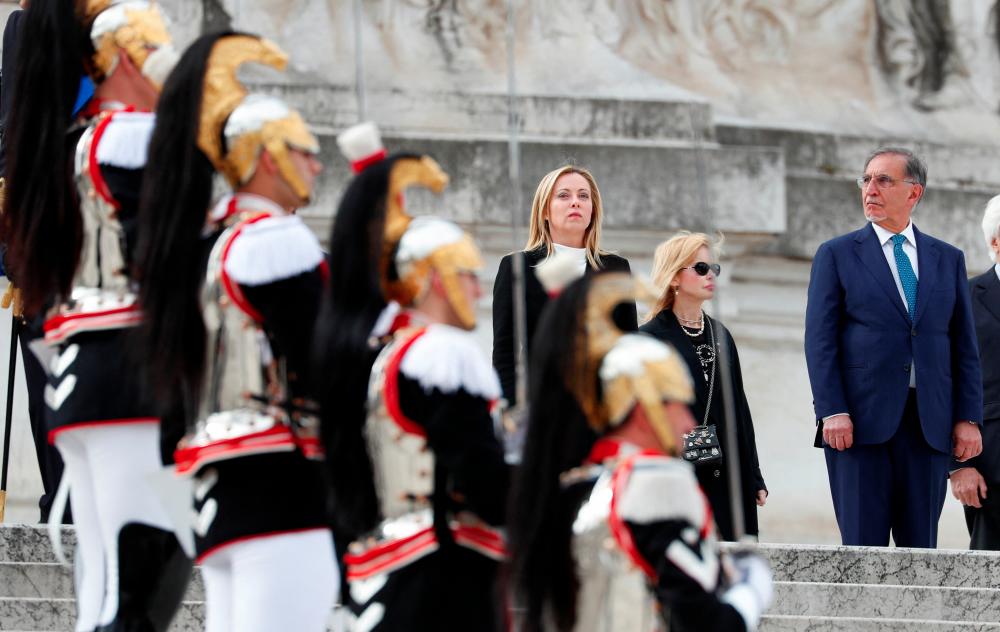 Italian Prime Minister Giorgia Meloni and Speaker of the Italian Senate Ignazio La Russa attend a Liberation Day ceremony at the Tomb of the Unknown Soldier in central Rome, Italy April 25, 2023. - REUTERSPIX