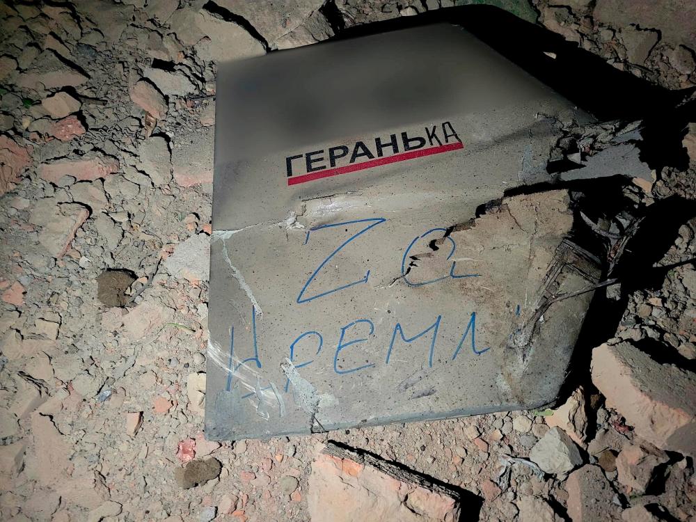 A view shows a part of a suicide drone Geran, which local authorities consider to be Iranian made unmanned aerial vehicle (UAV) Shahed-131/136, shot down during a Russian overnight strike, amid Russia's attack on Ukraine, in Odesa, Ukraine May 4, 2023. The inscription on the part reads: 'For Kremlin'. - REUTERSPIX
