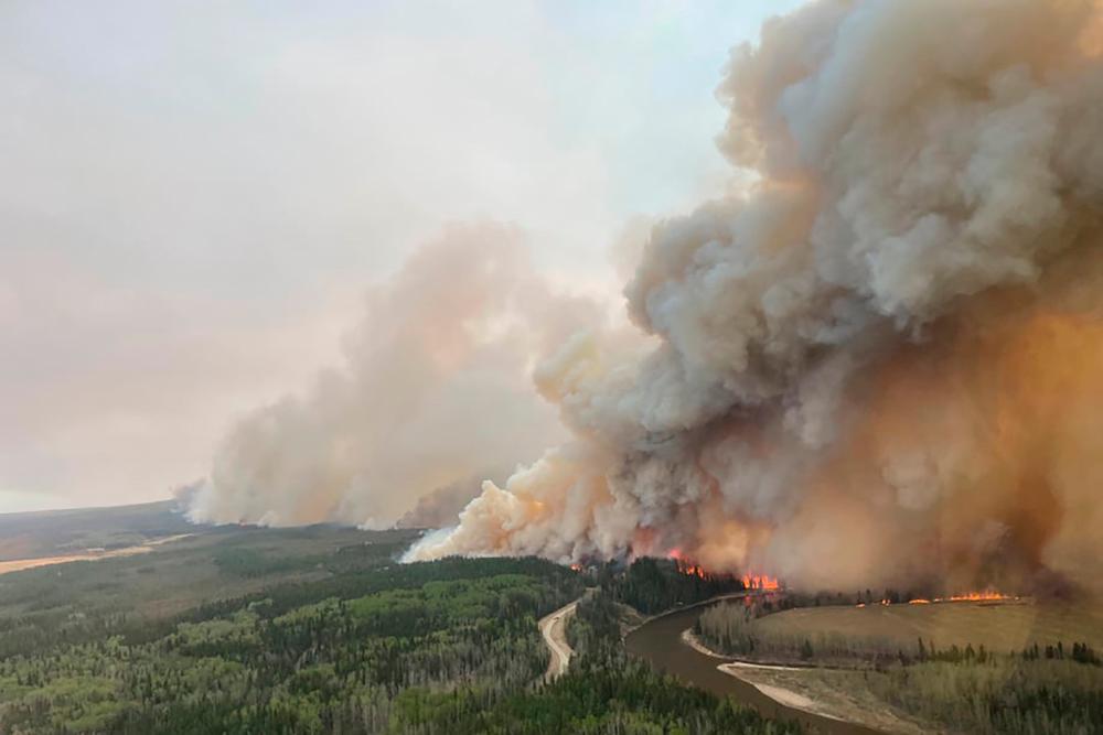 A smoke column rises from wildfire EWF-035 near Shining Bank, Alberta, Canada May 5, 2023. REUTERSPIX