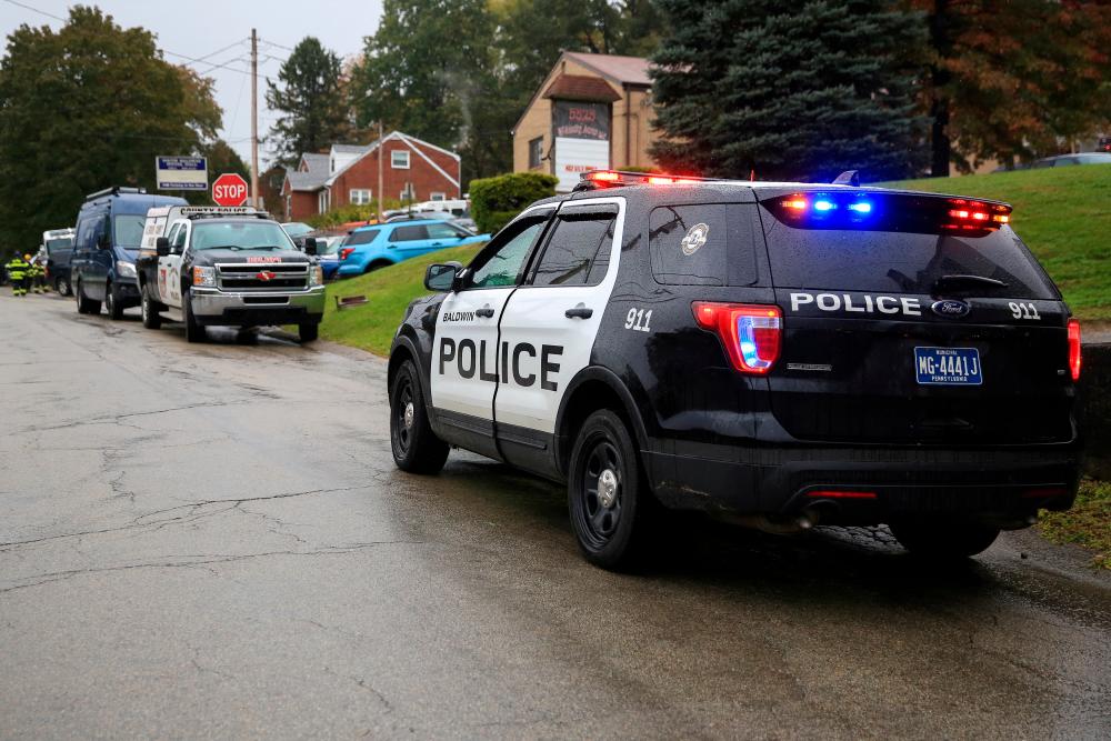 Police vehicles are deployed near the vicinity of the home of Pittsburgh synagogue shooting suspect Robert Bowers’ home in Baldwin borough, suburb of Pittsburgh, Pennsylvania, U.S., October 27, 2018/REUTERSPix