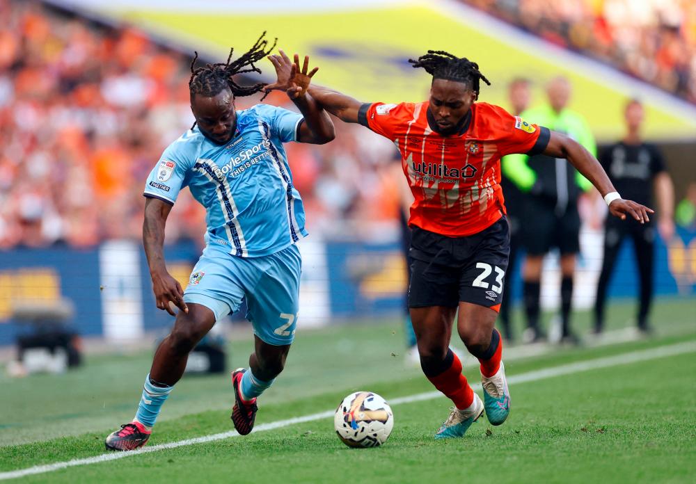 Coventry City’s Fankaty Dabo in action with Luton Town’s Fred Onyedinma/REUTERSPix