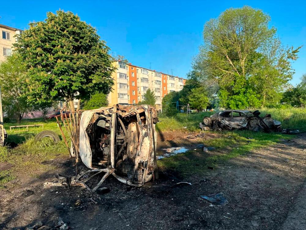 A view shows destroyed vehicles following what was said to be Ukrainian forces’ shelling in the course of Russia-Ukraine conflict in the town of Shebekino in the Belgorod region, Russia, in this handout image released May 31, 2023/AFPPix