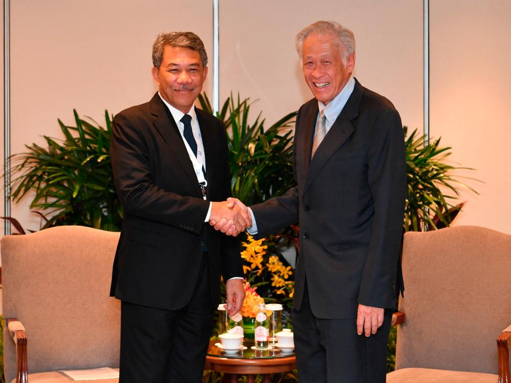 Dato’ Seri Mohamad Hasan meets with Singapore’s Minister for Defence Ng Eng Hen on the sidelines of the 20th Shangri-La Dialogue in Singapore June 2, 2023. REUTERSPIX