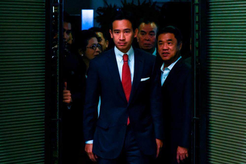 Move Forward Party leader Pita Limjaroenrat arrives with coalition party leaders ahead of a press conference following a meeting with coalition partners in Bangkok, Thailand, May 18, 2023. REUTERSpix