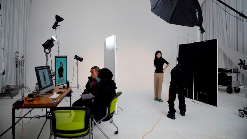 A model poses for a photo shooting session at a studio, during an organised media tour to the e-commerce solutions company Buy Quickly, in Shanghai - REUTERSpix