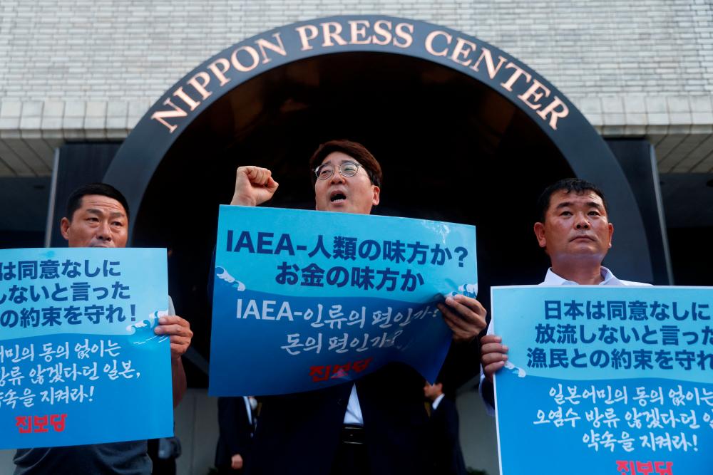 South Korean politician and fishermen protest, denouncing Japan’s Fukushima water release before the news conference by International Atomic Energy Agency (IAEA) chief Rafael Grossi (not in picture) outside Nippon Press Center building in Tokyo, Japan July 4, 2023. REUTERSPIX