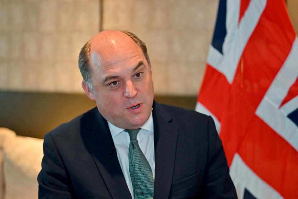 FILE PHOTO: British Secretary of State for Defence Ben Wallace speaks during an interview with Reuters on the sidelines of the 20th IISS Shangri-La Dialogue in Singapore June 2, 2023. - REUTERSPIX