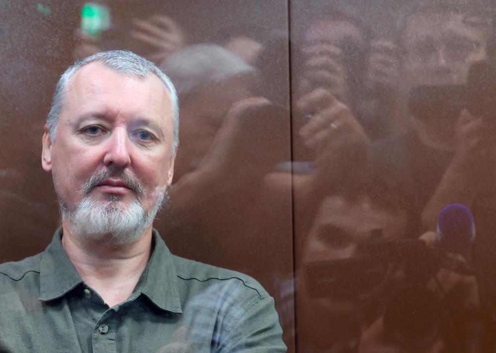 Russian nationalist Kremlin critic and former military commander Igor Girkin, also known as Igor Strelkov, who is charged with inciting extremist activity, sits behind a glass wall of an enclosure for defendants before a court hearing in Moscow, Russia, July 21, 2023/AFPPix