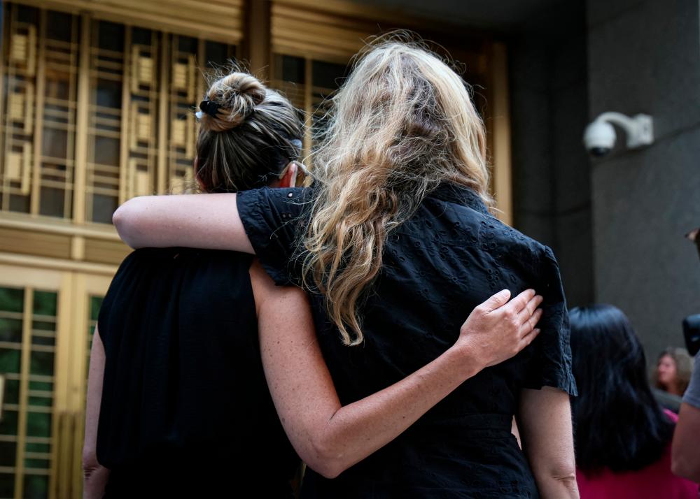 Sexual assault survivors embrace following the sentencing of former gynecologist Robert Hadden, outside the Manhattan federal court in New York City, US, July 25, 2023. REUTERSPIX