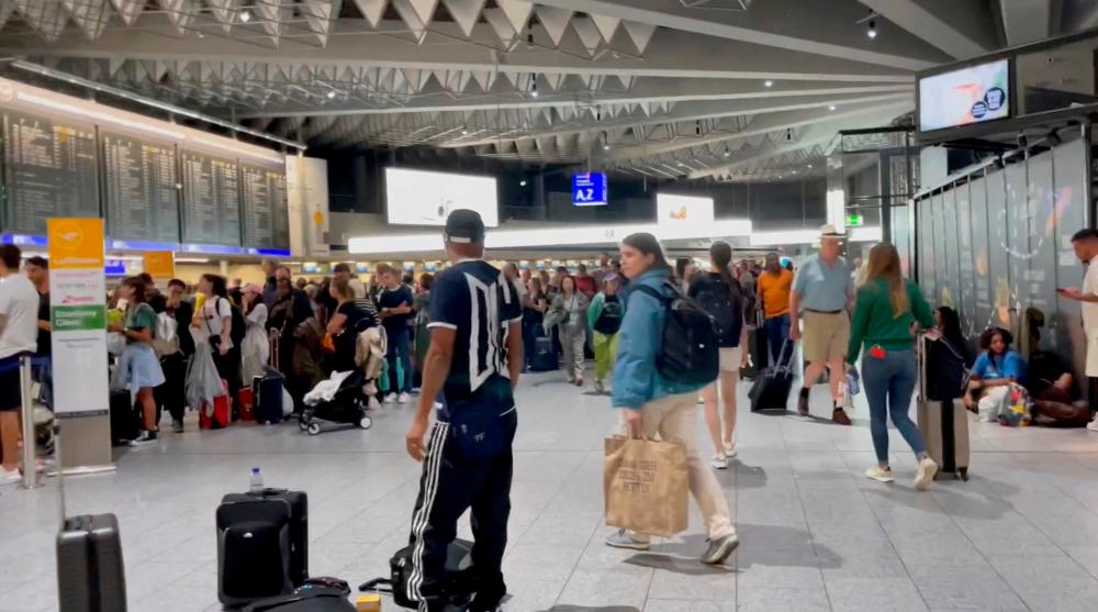 People gather at the airport as flights are cancelled or delayed due to floods, in Frankfurt, Germany, August 17, 2023 in this still image obtained from social media video/REUTERSPix