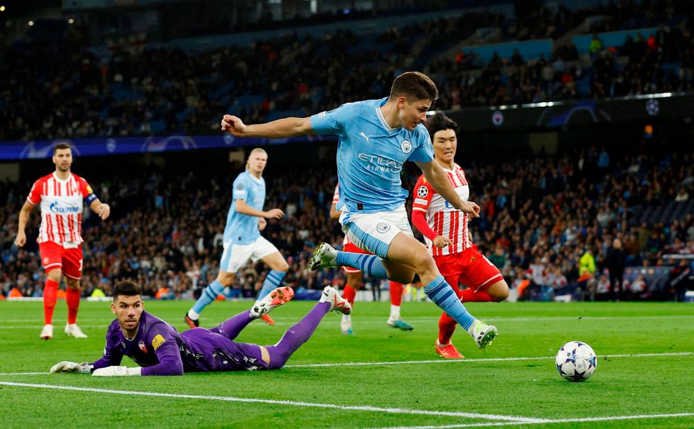 Football: Soccer-Alvarez helps Man City sweep past Red Star