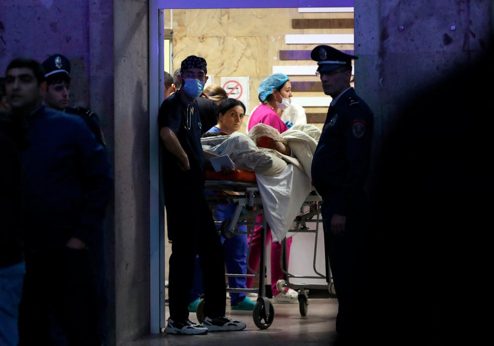 Medics assist a person injured in an explosion at a fuel depot near Stepanakert in the Nagorno-Karabakh region, at the National Burn Center in Yerevan, Armenia September 26, 2023. REUTERSPIX