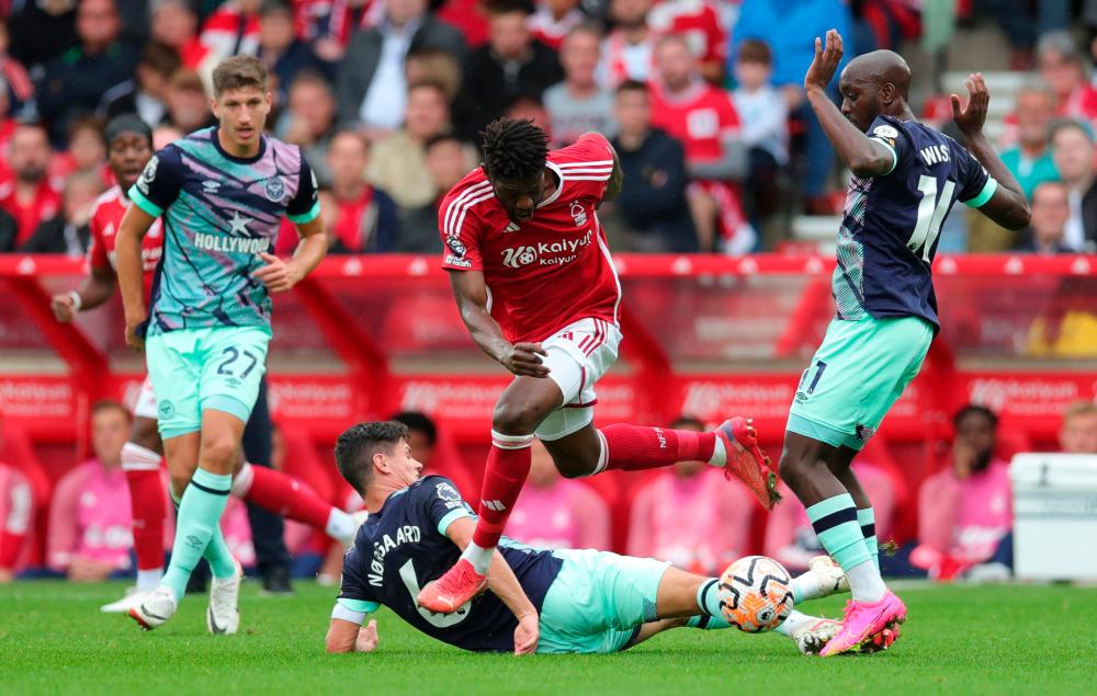 Football - Premier League - Nottingham Forest v Brentford - The City Ground, Nottingham, Britain - October 1, 2023 Nottingham Forest’s Ibrahim Sangare in action with Brentford’s Yoane Wissa and Christian Norgaard. REUTERSPIX