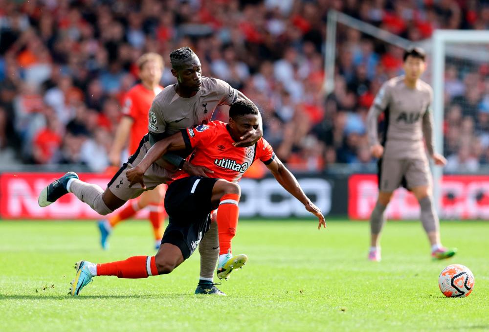 Football - Premier League - Luton Town v Tottenham Hotspur - Kenilworth Road, Luton, Britain - October 7, 2023Tottenham Hotspur's Yves Bissouma in action with Luton Town's Chiedozie Ogbene. REUTERSPIX