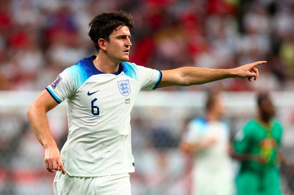 FILE PHOTO: Football - FIFA World Cup Qatar 2022 - Round of 16 - England v Senegal - Al Bayt Stadium, Al Khor, Qatar - December 4, 2022England's Harry Maguire reacts - REUTERSPIX