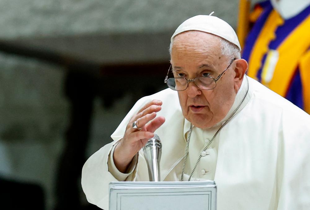Pope Francis gives a blessing at the end of the weekly general audience, in Paul VI hall at the Vatican, December 13, 2023/REUTERSPix
