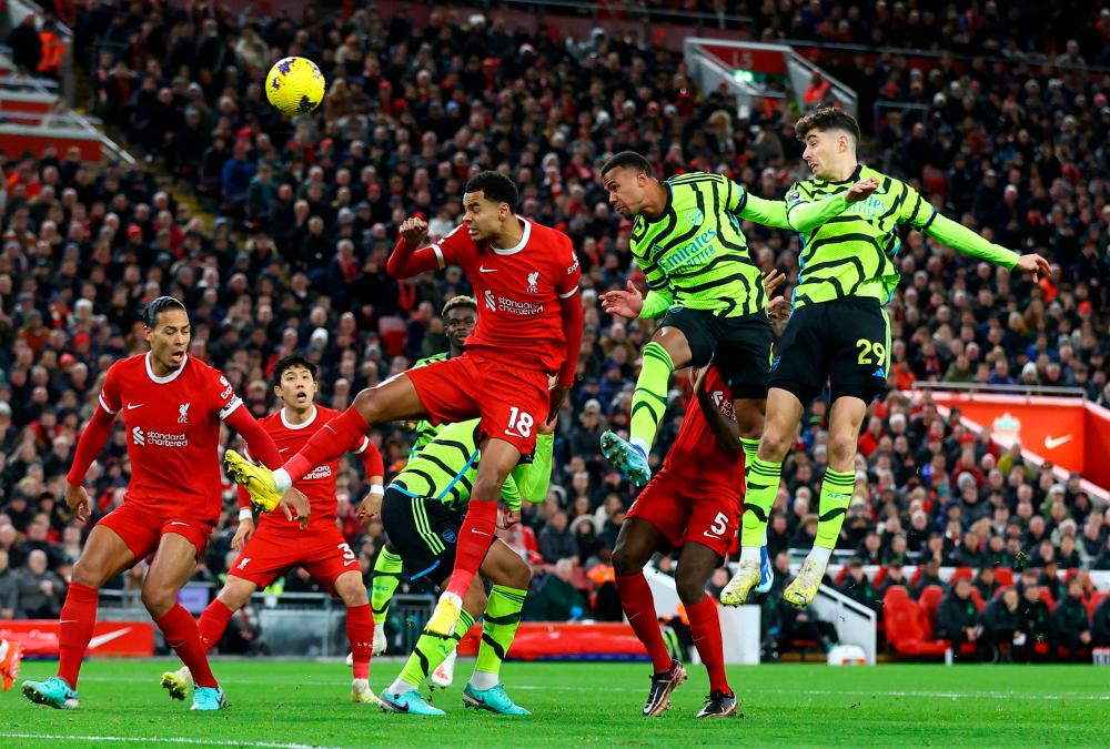 Football - Premier League - Liverpool v Arsenal - Anfield, Liverpool, Britain - December 23, 2023 Arsenal's Gabriel scores their first goal - REUTERSPIX