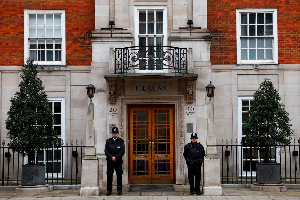 Police officers stand guard outside the London Clinic where Britain’s King Charles receives treatment for an enlarged prostate in London, Britain January 29, 2024/REUTERSPix