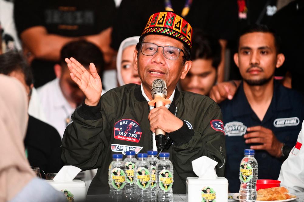 Vice presidential candidate Mahfud MD, speaks to journalists during his campaign rally after announcing in a live-streamed Instagram statement that he would tender his resignation as Indonesia’s Chief Security Minister, in Banda Aceh, Indonesia, January 31, 2024/REUTERSPix