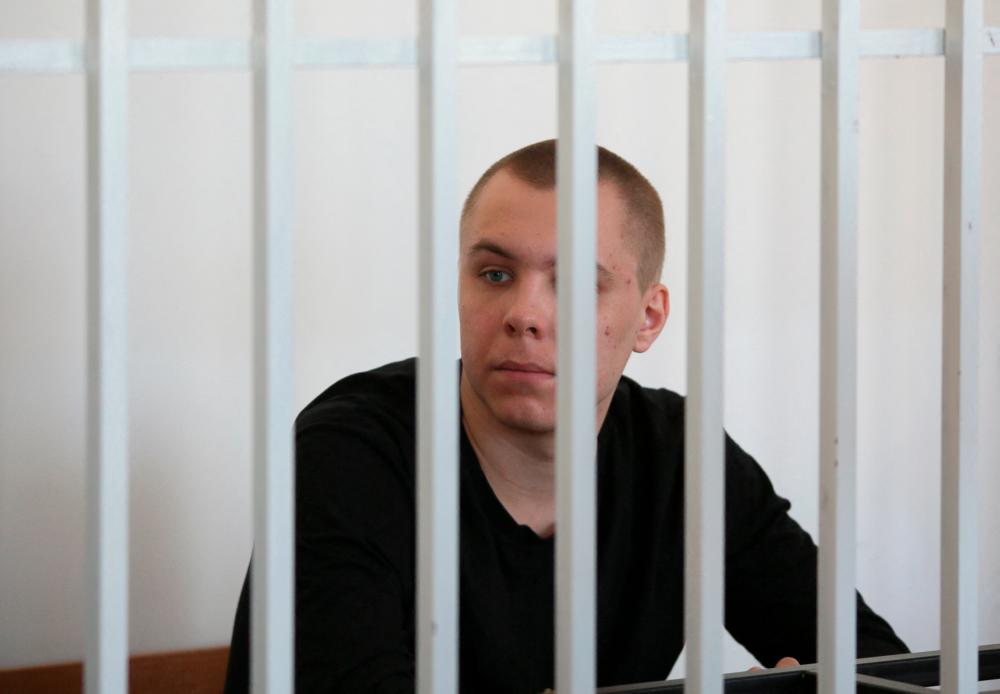 Defendant Nikita Zhuravel, who was detained in May 2023 under a law against offending religious believers’ feelings after he burned a copy of the Koran outside a mosque in Volgograd city, attends a court hearing in the Chechen capital of Grozny, Russia/REUTERSPix