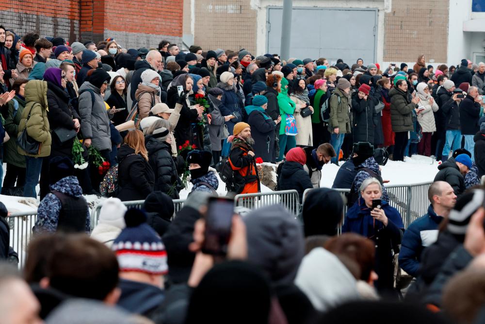 People gather near the Soothe My Sorrows church, where a funeral service and a farewell ceremony for Russian opposition politician Alexei Navalny are held, in Moscow, Russia, March 1, 2024/REUTERSPix