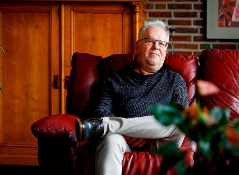 Bert Janssen, 57 years old, sits on a sofa in his house in Herkenbosch, Netherlands February 29, 2024. He underwent a heart transplant at the age of 17, almost 40 years ago, receiving a donor heart which is now immortalized in the Guinness Book of Records/REUTERSPix