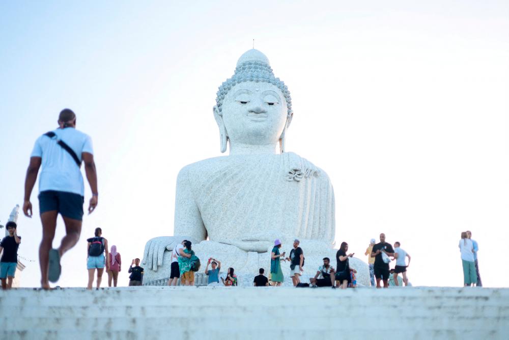 Filepix: Tourists visit the Big Buddha statue in Phuket, Thailand/REUTERSPix