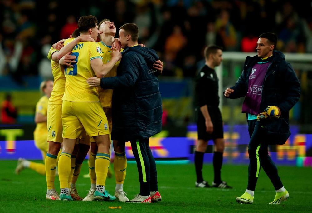 Football - Euro 2024 Qualifier -Play-Off- Ukraine v Iceland - Stadion Miejski Wroclaw, Wroclaw, Poland - March 26, 2024Ukraine players celebrate after qualifying for Euro 2024 - REUTERSPIX
