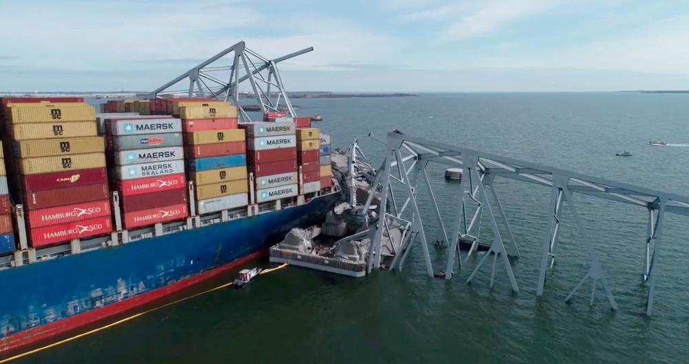 A drone view of the Dali cargo vessel, which crashed into the Francis Scott Key Bridge causing it to collapse, in Baltimore, Maryland, U.S., March 26, 2024, in this still image taken from a handout video. - REUTERSPIX