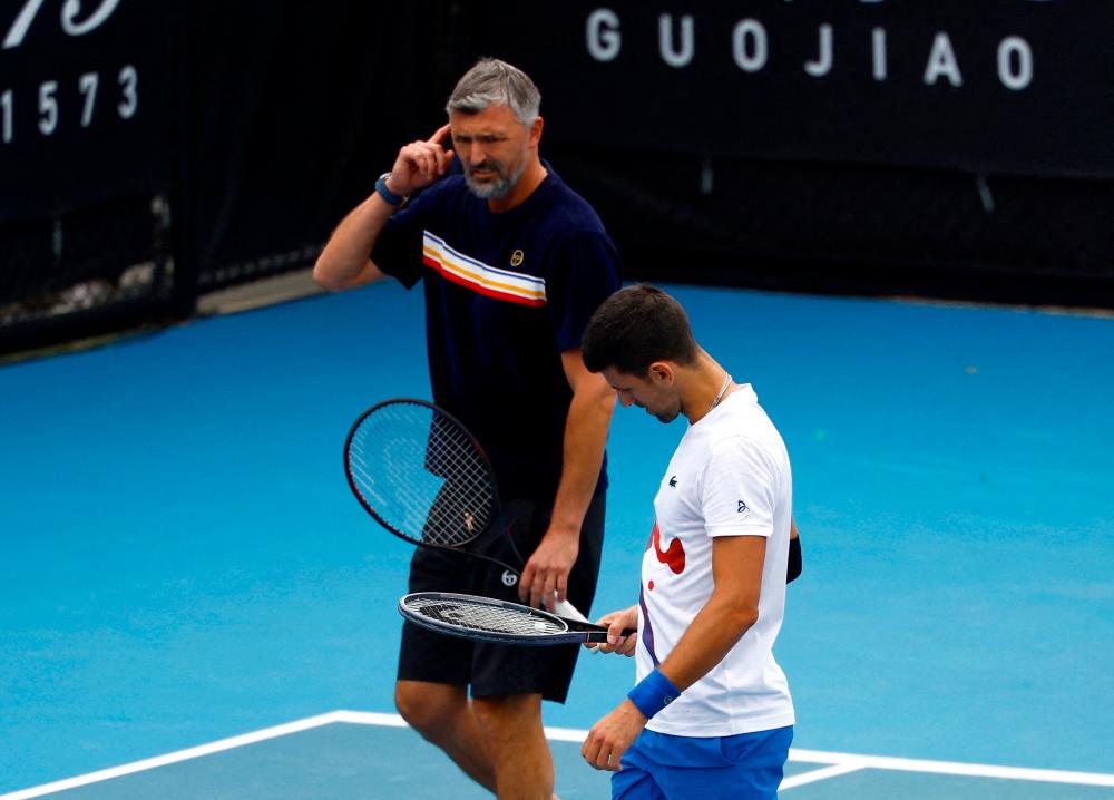 Filepix: Serbia’s Novak Djokovic and his coach Goran Ivanisevic react during a practice session/REUTERSPix