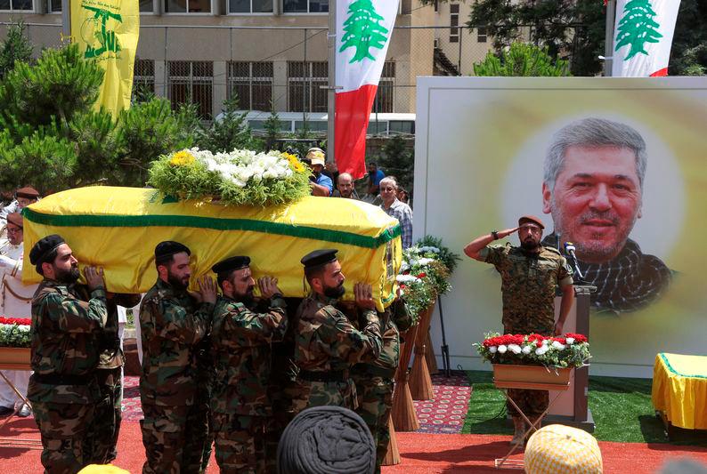 Members of Hezbollah carry the coffin of Taleb Abdallah, also known as Abu Taleb, a senior field commander of Hezbollah who was killed by what security forces say was an Israel strike yesterday night - REUTERSpix
