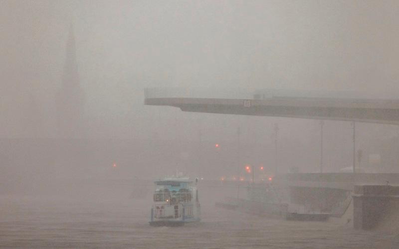 A general view shows the Kremlin and the embankment of Moskva River as the storm approaches, in Moscow. - REUTERSpix