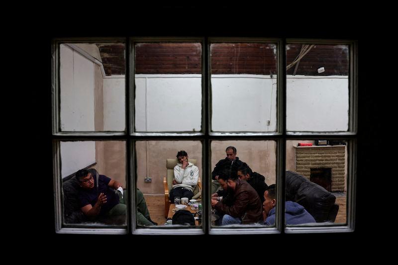 Squatters rest in a room used as a common room of the place they live, which was once a school and is now occupied by squatter activist group Reclaim Croydon, in Croydon, south London, Britain, May 16, 2024. - REUTERSPIX