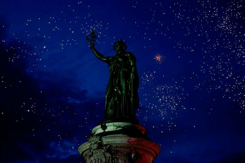 The statue of Marianne is seen among fireworks as people gather at the Place de la Republique after partial results in the second round of the early French parliamentary elections, in Paris - REUTERSpix