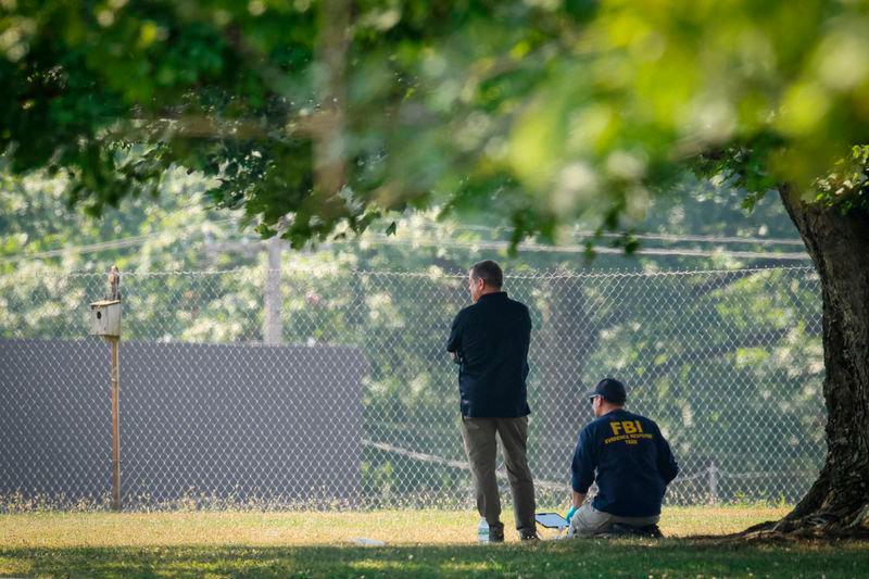 Members of the FBI Evidence Response Team, work near the building where a gunman was shot dead by law enforcement - REUTERSpix