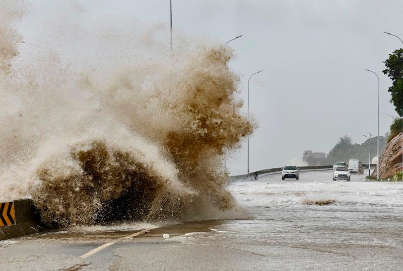FILE PHOTO: Waves crash on the coast of Sansha town as Typhoon Gaemi approaches, in Ningde, Fujian province, China July 25, 2024. - cnsphoto via REUTERS