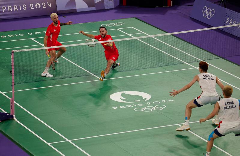 Paris 2024 Olympics - Badminton - Men's Doubles Group play stage - Porte de La Chapelle Arena, Paris, France - July 27, 2024.Ben Lane of Britain and Sean Vendy of Britain in action during the Group A match against Aaron Chia of Malaysia and Wooi Yik Soh of Malaysia. - REUTERSPIX