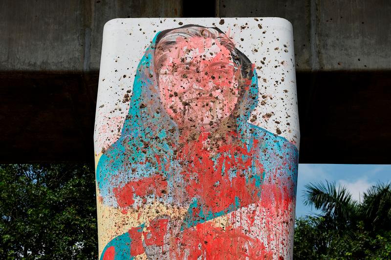 A mural of Bangladeshi Ex Prime Minister Sheikh Hasina is seen vandalised by protesters days before in Dhaka - REUTERSpix
