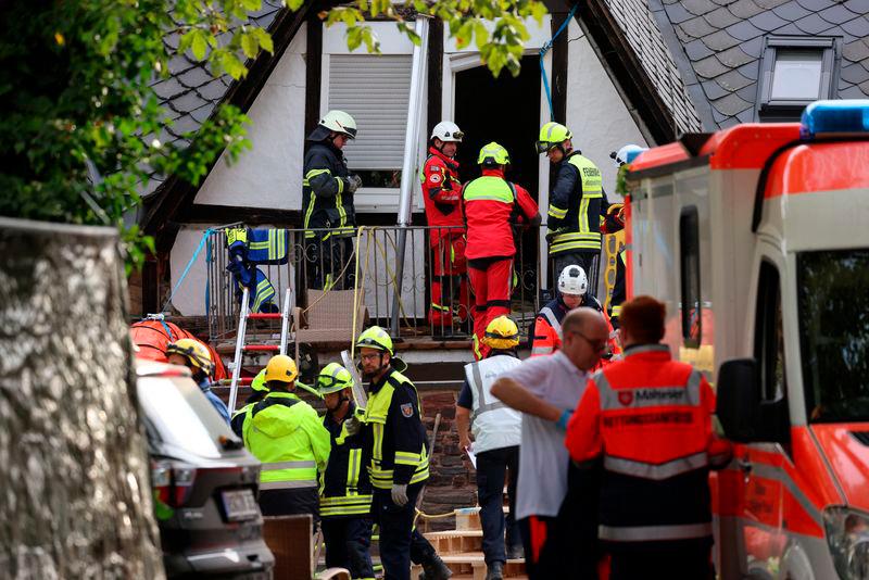 Firefighters and medical staff work at the scene after a hotel partially collapsed overnight near the banks of Germany’s river Moselle in Kroev, Germany, August 7, 2024/REUTERSPIX