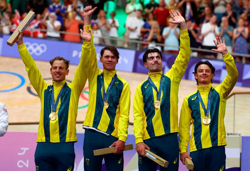 Nina Kennedy of Australia celebrates with her national flag after winning gold - REUTERSpix