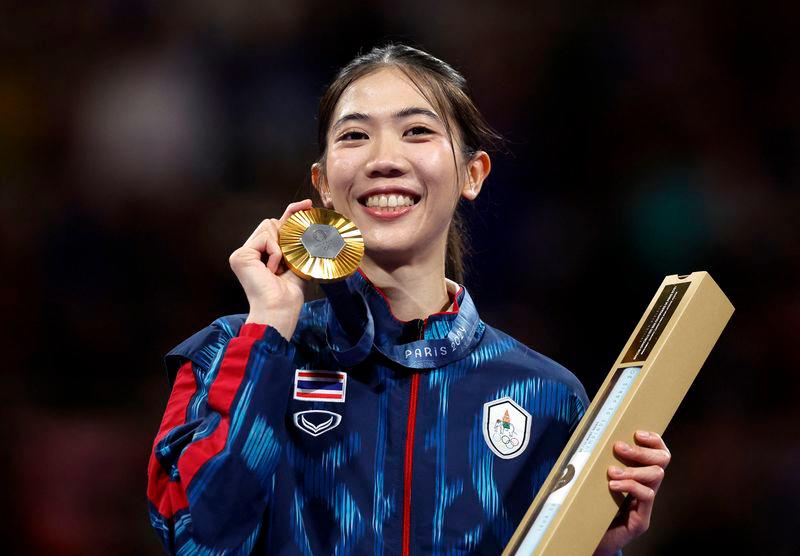 Panipak Wongpattanakit of Thailand celebrates on the podium after winning the Gold medal - REUTERSpix